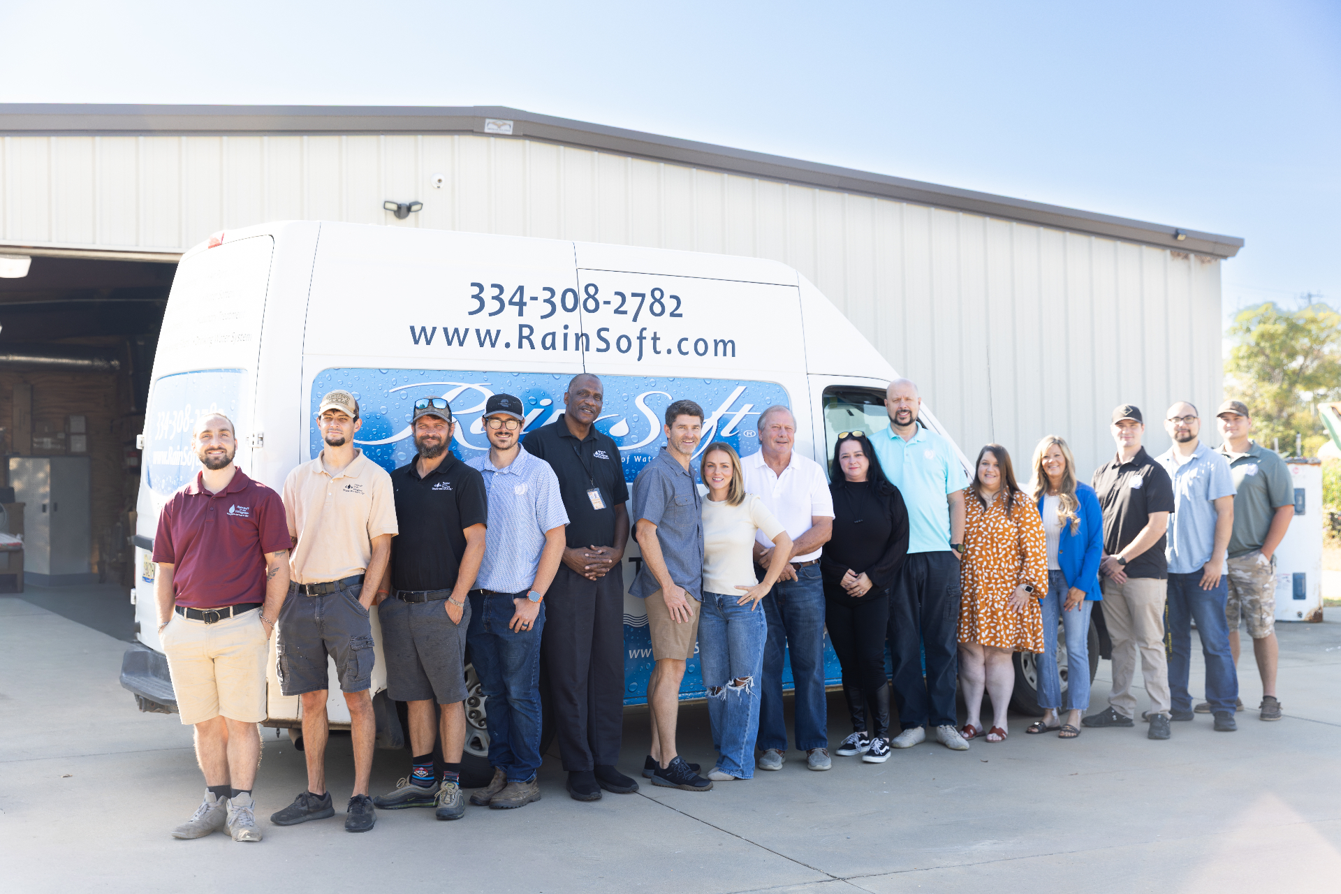 Full RainSoft team standing by branded service van